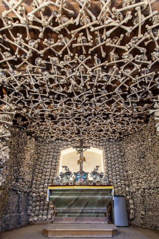 Illustration for article titled These Buildings Are Made with Skulls and Bones